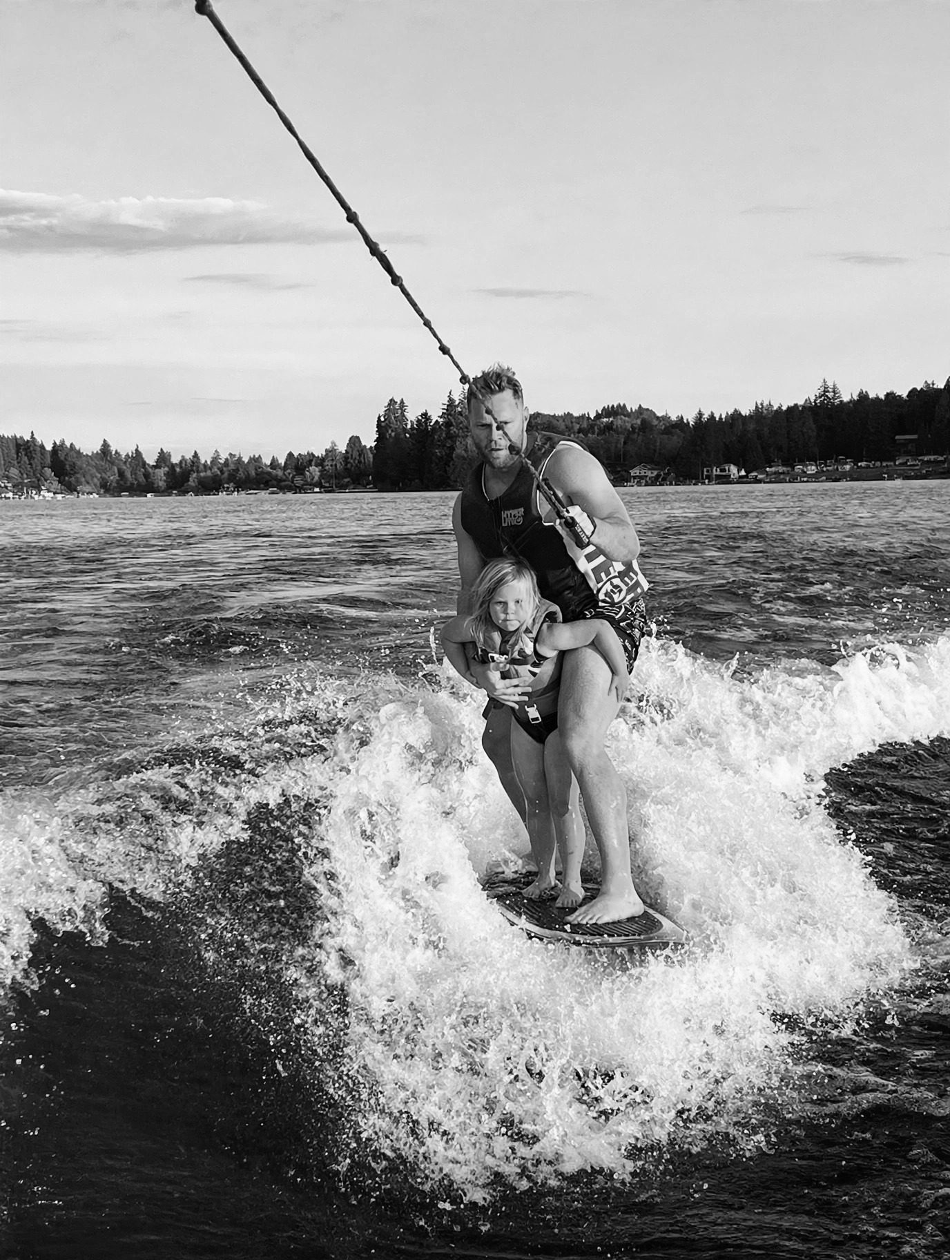 Colin wakesurfing with his child