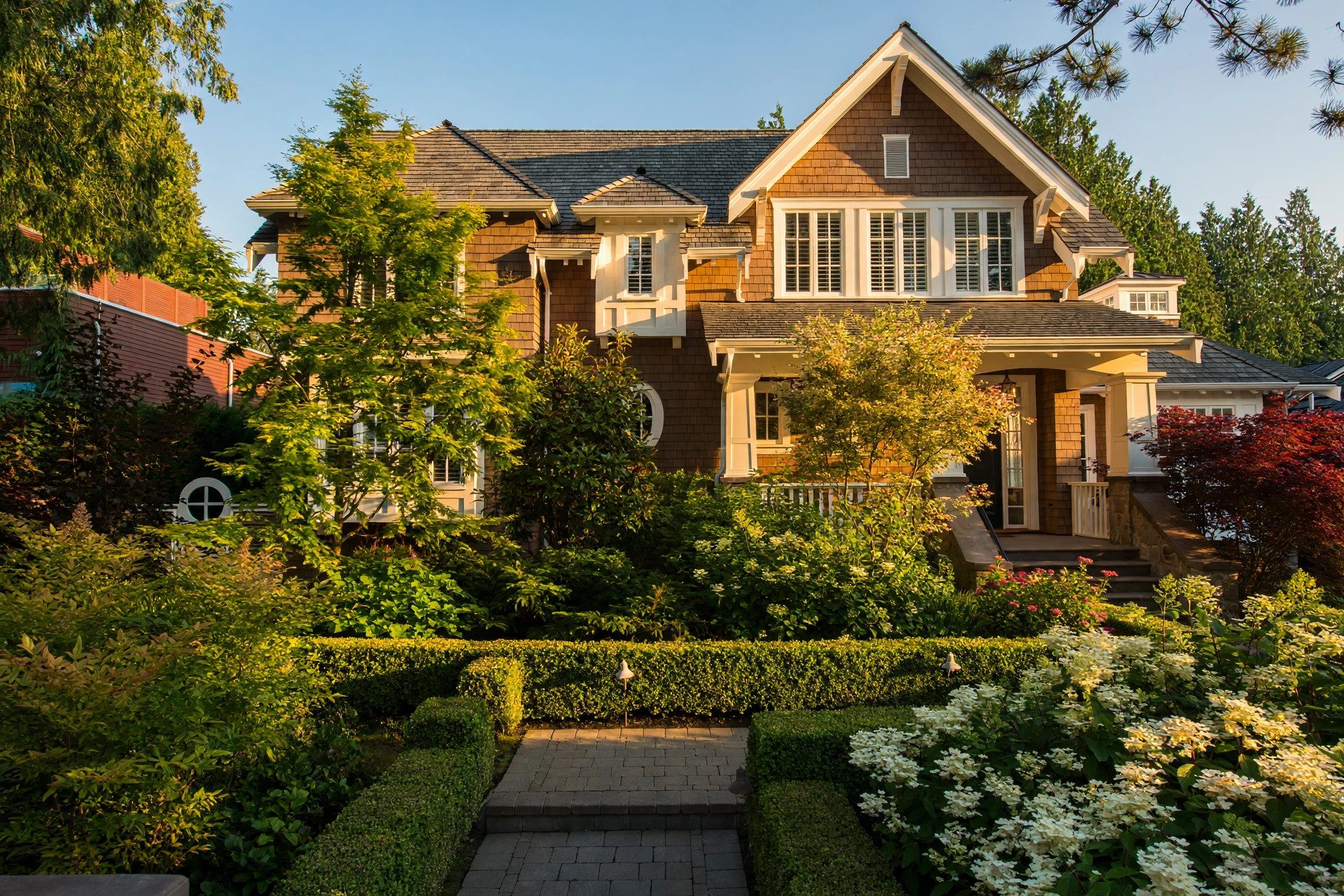 Craftsman residence framed by a mature front garden