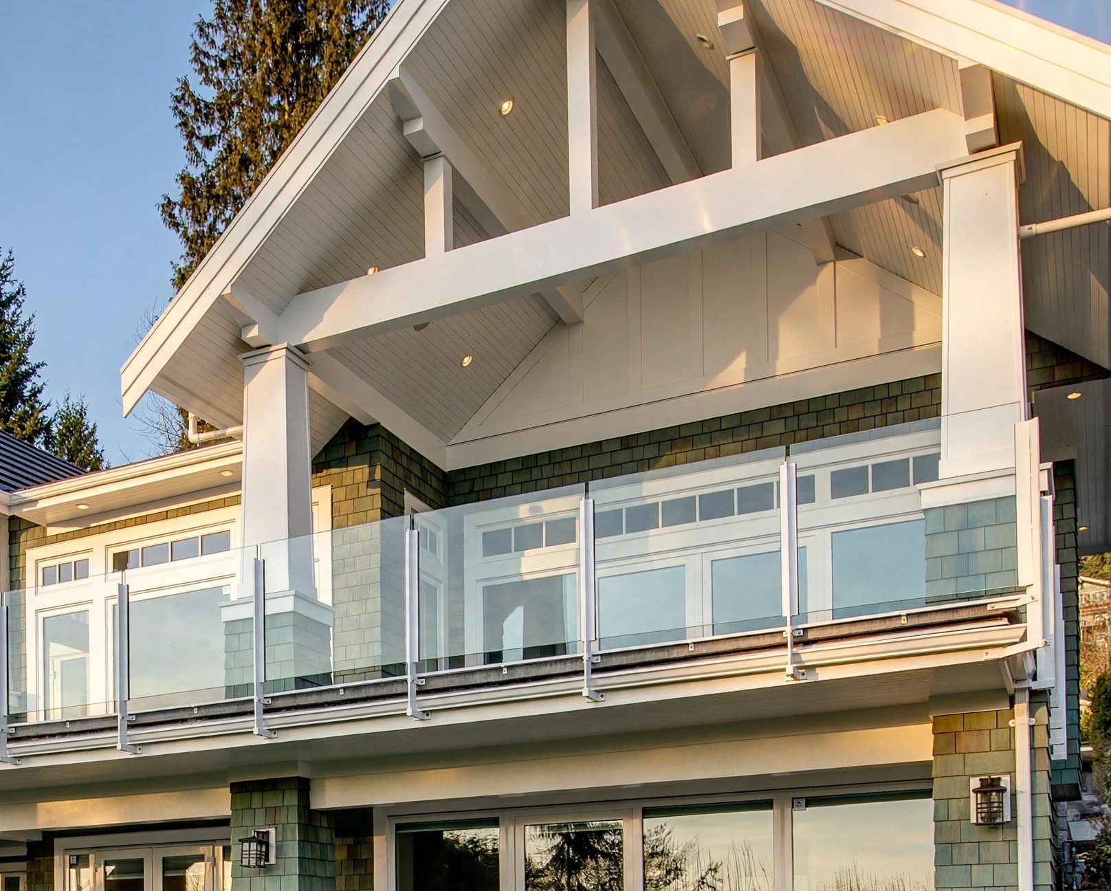 Contemporary hillside residence with broad balconies and water views