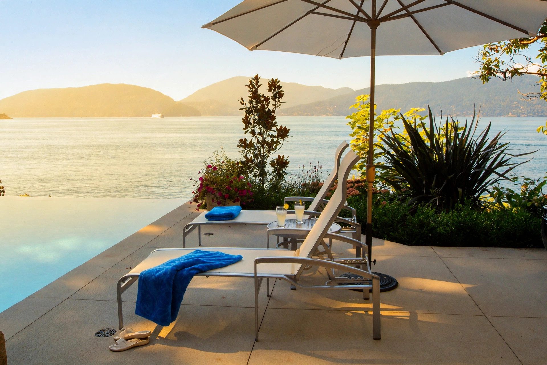 Infinity pool terrace overlooking the water and mountains