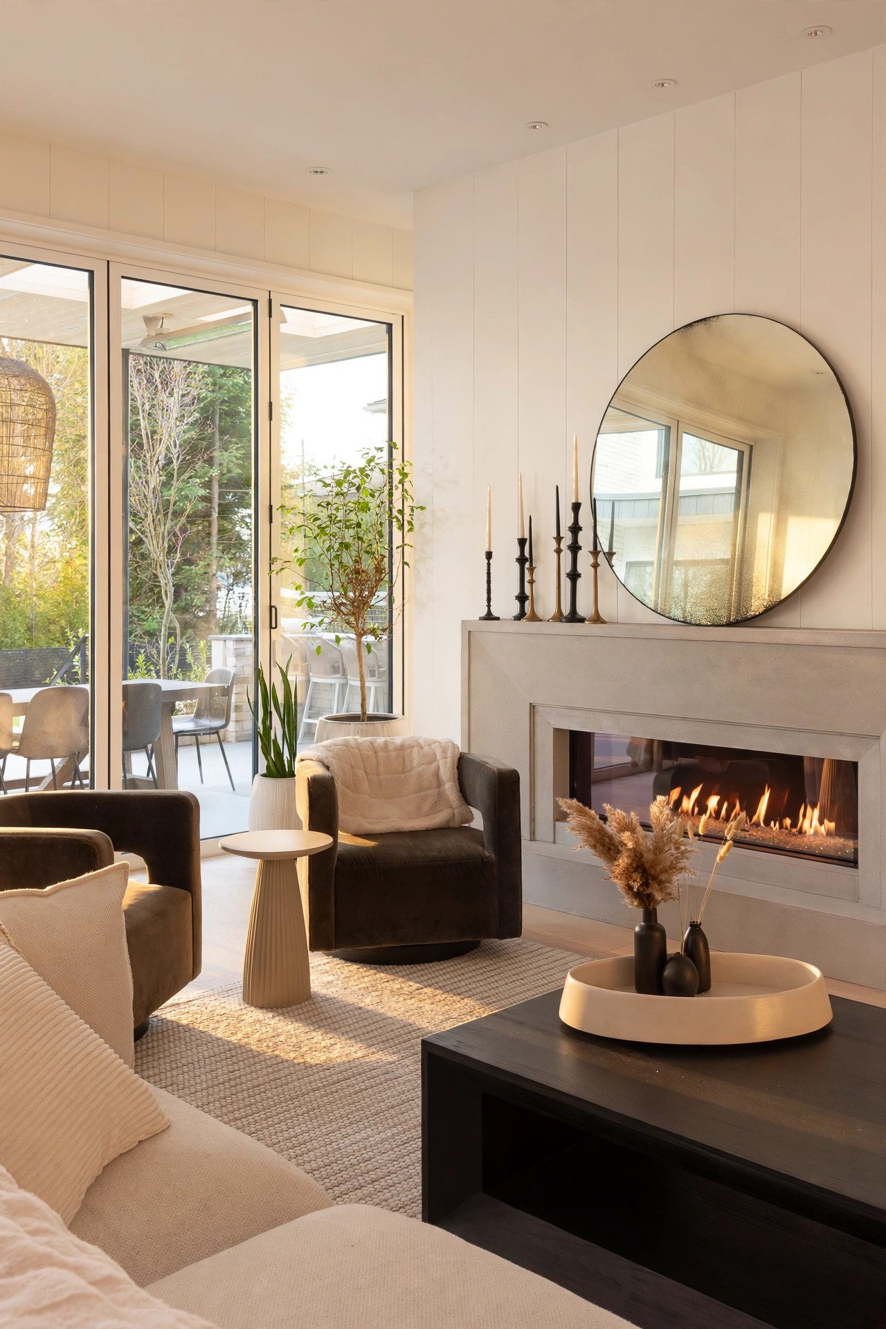 Light-filled living room with a modern fireplace and garden terrace